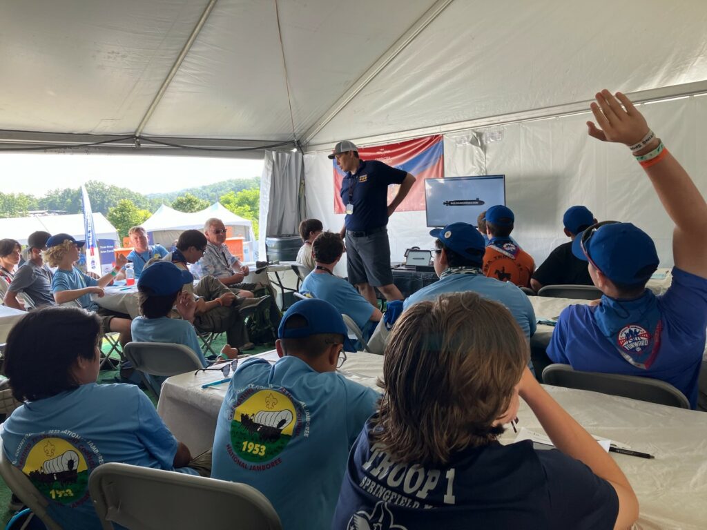 Photo of Scouts participating in lesson at Medal of Honor tent.